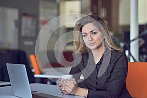 Young and beautiful businesswoman tired from work in the office.Woman holding her head.