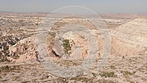 Young beautiful caucasian athlete woman running uphill on top mountain outdoors with scenic panorama. The athlete fit and firm