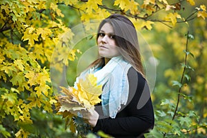 Young beautiful caucasian plus size model in black dress outdoors, xxl woman on nature, autumn atmosphere