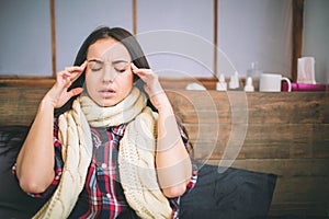 Young beautiful Caucasian woman on bed having headache insomnia migraine stress. photo