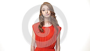 Young beautiful caucasian woman in gorgeous orange dress standing and say no isolated over white background while