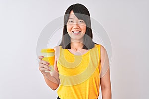 Young beautiful Chinese woman drinking take away coffee over isolated white background with a happy face standing and smiling with