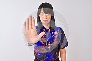 Young beautiful chinese woman wearing summer floral t-shirt over isolated white background doing stop sing with palm of the hand