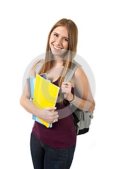 Young beautiful college student girl carrying backpack and books posing happy and confident in university education concept