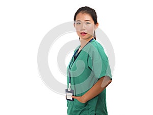 Young beautiful and confident Asian Chinese medicine doctor woman or hospital nurse in green scrubs posing serious  in corporate