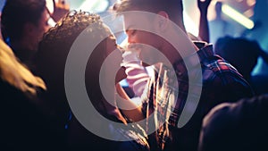 Young Beautiful Couple Enjoying Time Together in Crowd at a Rock Band Concert. Handsome Man and Pr