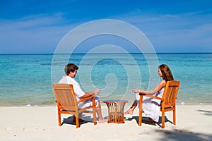 Young beautiful couple enjoying on a tropical beach