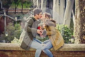 Young beautiful couple in love celebrating Valentines day presents and toast