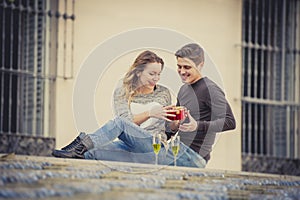 Young beautiful couple in love celebrating Valentines day presents and toast