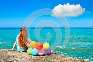 Young beautiful couple in love sitting coast while honeymoon