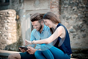 Young beautiful couple lovers using tablet