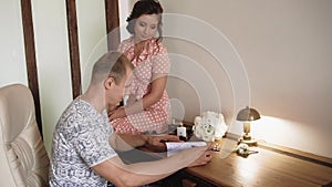 Young beautiful couple in the morning getting ready for their indoor wedding, slow motion