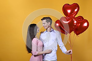 Young beautiful couple posing in studio.