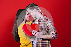 Young beautiful couple posing in studio.