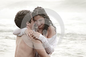 Young beautiful couple sharing an intimate moment photo