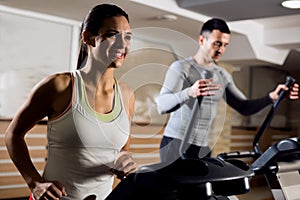 Young beautiful couple working out cardio training