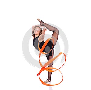 Young beautiful dancer gymnastics posing in studio with color ribbon