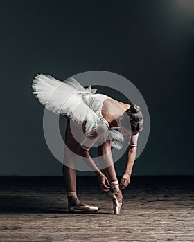 Young beautiful dancer posing in studio
