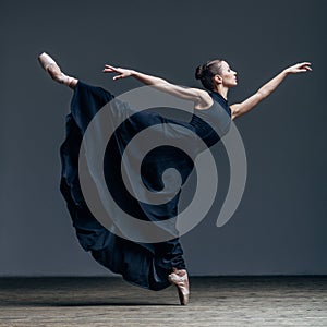 Young beautiful dancer posing in studio