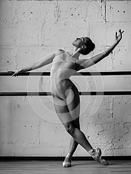 Young beautiful dancer posing in studio