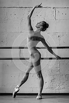 Young beautiful dancer posing in studio