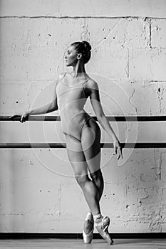 Young beautiful dancer posing in studio