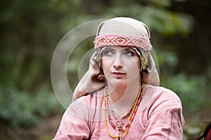 Young beautiful  in a dress and scarf of the Viking Age.