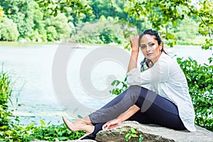 Young Beautiful East Indian American Woman traveling, relaxing at Central Park, New York