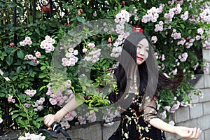 Young beautiful, elegantly dressed woman with bicycle. Healthy, cycling