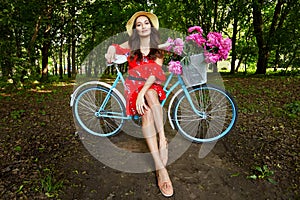 Young beautiful, elegantly dressed woman with retro bicycle. Healthy, cycling.