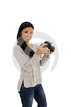 Young beautiful exotic hispanic photographer woman smiling happy looking reflex camera