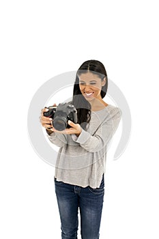 Young beautiful exotic hispanic photographer woman smiling happy looking reflex camera