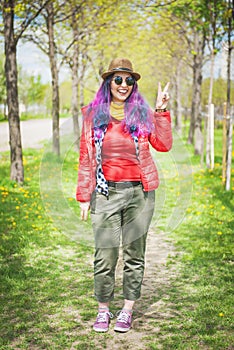 Young beautiful fashion hipster woman with colorful hair