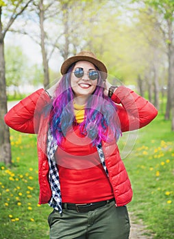 Young beautiful fashion hipster woman with colorful hair