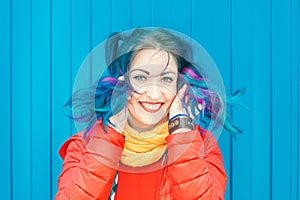 Young beautiful fashion hipster woman with colorful hair having