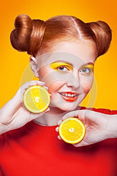 Young beautiful fashion model with Lemon. studio shot.