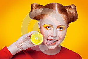 Young beautiful fashion model with Lemon. studio shot.