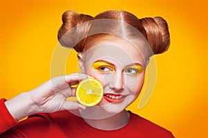 Young beautiful fashion model with Lemon. studio shot.