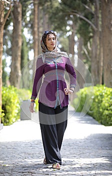 Beautiful iranian woman in Fin gardens in Kashan, Iran