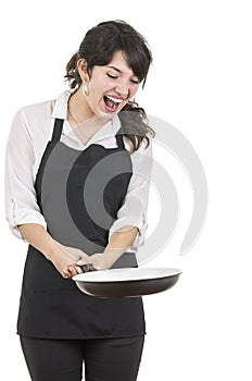 Young beautiful female chef wearing black apron