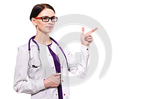 Young beautiful female doctor showing sign on white background