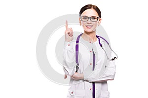 Young beautiful female doctor showing sign on white background