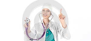 Young beautiful female doctor with stethoscope showing atention sign