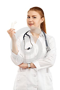 Young beautiful female doctor in white uniform isolated on white