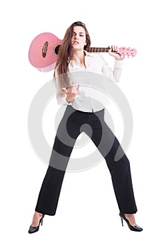 young and beautiful female or woman guitarist