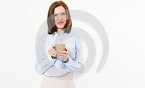 Young beautiful friendly girl holding a mug of hot tea or coffee and posing on a white background