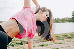 young beautiful girl athlete jogging. beautiful girl athlete is engaged in jogging. morning running. healthy sport lifestyle photo