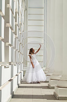 Young beautiful girl in ballroom prom dress