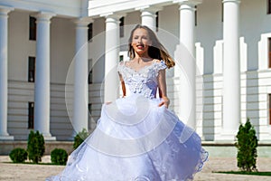 Young beautiful girl in ballroom prom dress