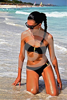 Young Beautiful Girl In Bikini On The Tropical Beach and sea background